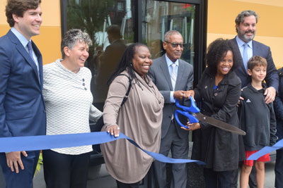 A photo from the ribbon-cutting ceremony at Harbor125/Harborwalk Residences in Boston, July 12, 2021