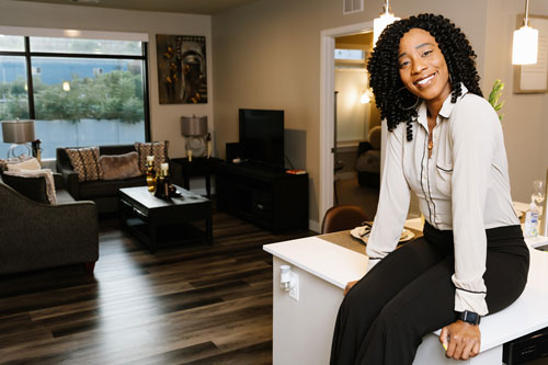 A photo of Chazzie Henderson, resident of a MassHousing-financed rental community